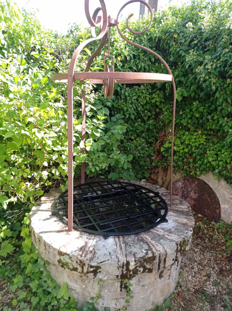 grille de puits réalisée par ferronnier